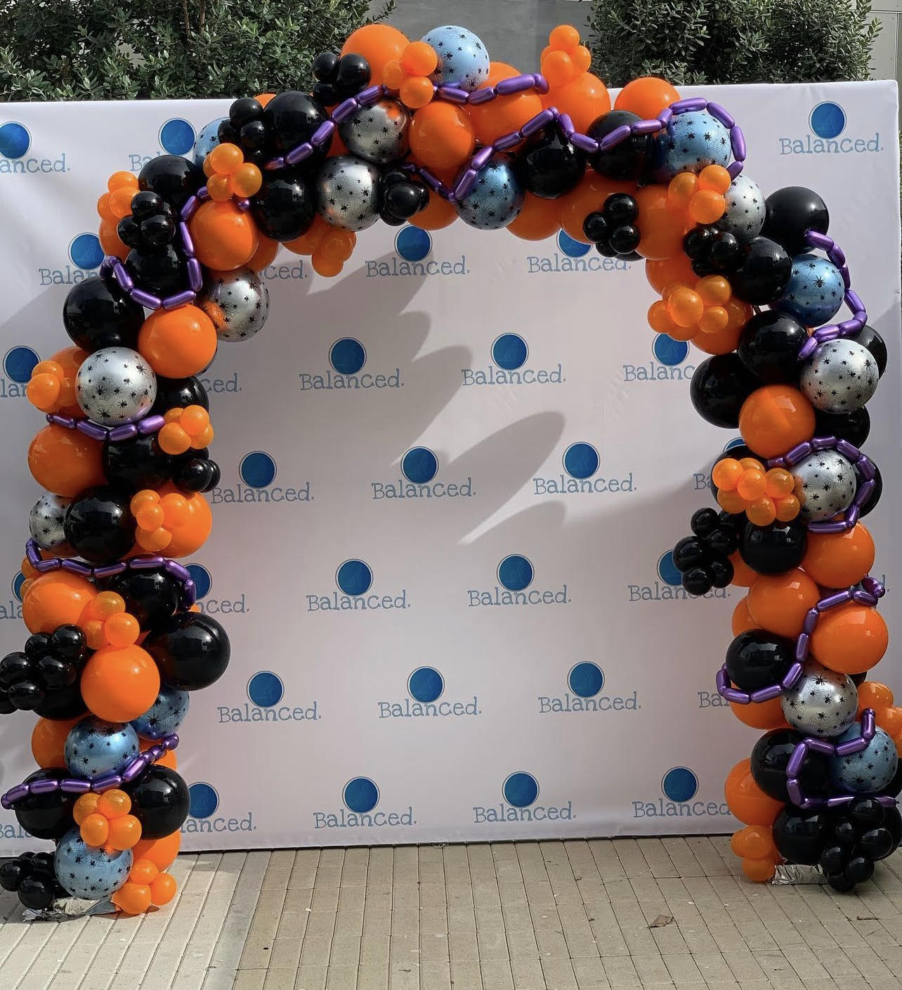 Orange, black, silver and purple Halloween balloon arch